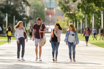 Students walk down the main walkway at Kensington campus towards Anzac parade