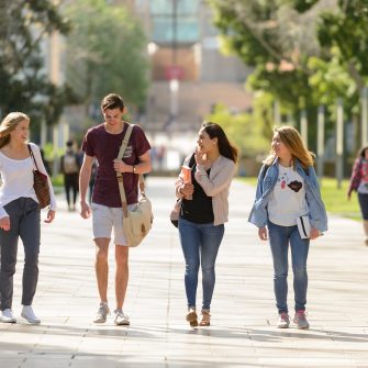 Students walk down the main walkway at Kensington campus towards Anzac parade
