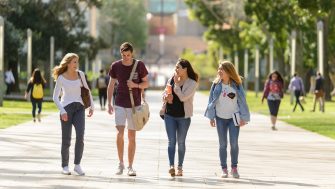 Students walk down the main walkway at Kensington campus towards Anzac parade