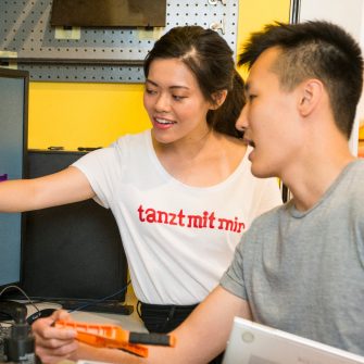 Students participating in design and woodwork