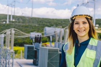 Female Student on Site Wearing Hi Vis & Hard Hat