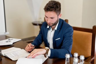 Lawyer in a suit sitting at his desk