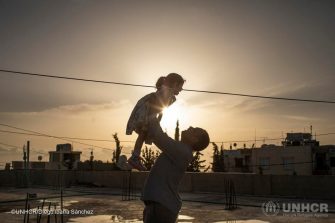 Thirty-seven-year-old Syrian refugee Mouhamad plays with his three-year-old daughter Yasmine Al Sham on the rooftop of their house in Barja, Lebanon. ; Wafaa Ahmad Hachem, 32, her husband Mouhamad Al Dali Al Masri, 37, their son Bakr, 13, and daughters, Layan, 10, Ghofran, 8, and Yasmine Al Sham, 3, come from the village of Gdaidet al Turkman in east Ghouta, just outside the Syrian capital Damascus. They fled to Lebanon in 2014, and are awaiting resettlement to Norway. The COVID-19 pandemic has suspended international resettlement for refugees worldwide, dividing some families and stranding them thousands of miles apart. UNHCR is concerned that international travel could increase the exposure of refugees to the virus. As resettlement remains a life-saving tool for many refugees, UNHCR is appealing to States to ensure that movements can continue for the most critical emergency cases wherever possible.