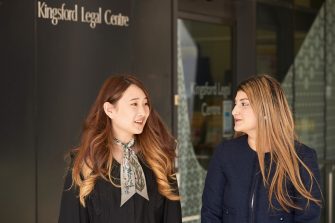 Two female Law students in front of Kingsford Legal Centre