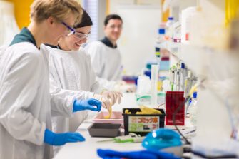 Scientists working at lab bench