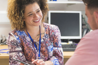 lady smiling at colleague