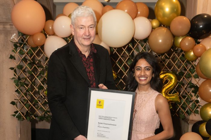 SWS clinical school graduate receiving an award 