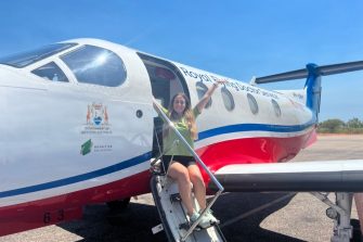 Placement student Rebecca on Doctors service aeroplane steps