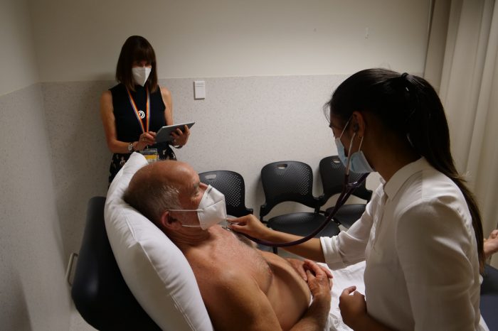 Student conducting cardio exam