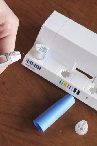 A man preparing a Semaglutide Ozempic injection.
