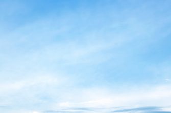 The sky is large, bright, beautiful and has white clouds.