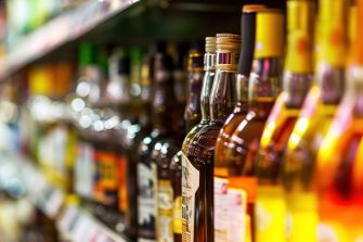 Alcoholism among young people - teenager drinking beer