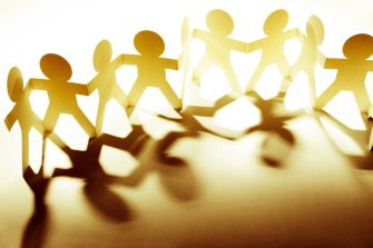 Team of paper doll people