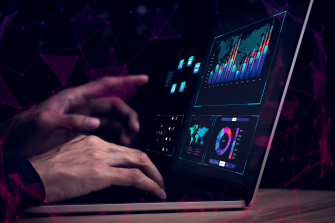 Person typing research on laptop