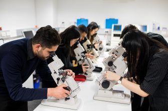 Photograph of science students using microscopes