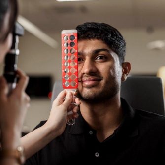 A photo of a man getting an eye test