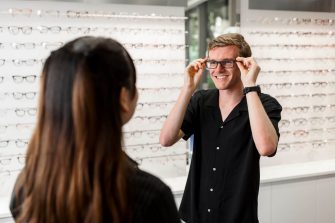 trying on glasses in optometry class