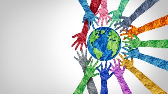 Global culture and world diversity or earth day and international cultures as a concept of diverse races and crowd cooperation symbol as hands holding together the planet earth.