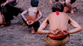 Indigenous Australians dancing in their native body paint