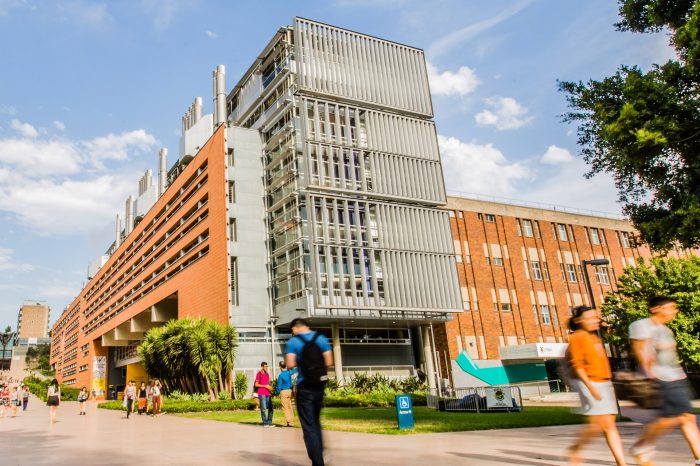 students walking in front of Red Centre building adjusted to use as co-location header