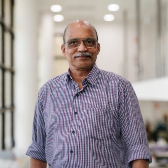 Mohan Bhadbhade staff headshot in chemical crystallography lab