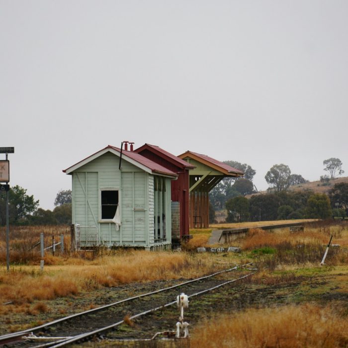 Rural place with railway track and small houses