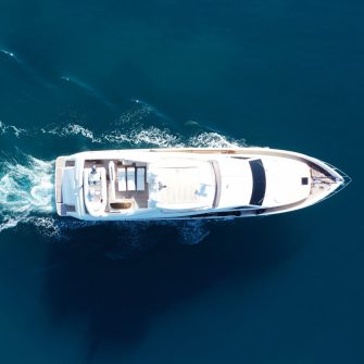 Aerial drone photo of luxury yacht cruise in mediterranean deep blue sea