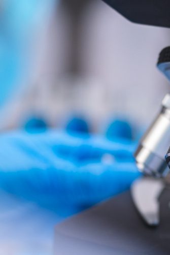 Mother holding her baby indoors