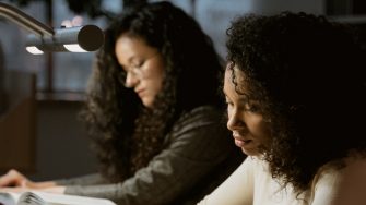 Students studying at library 