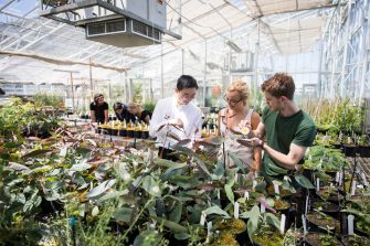 Photograph of science students in a garden centre
