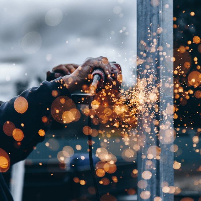 Person holding tool during daytime