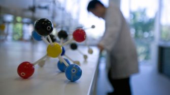 Molecule model on bench in a lab
