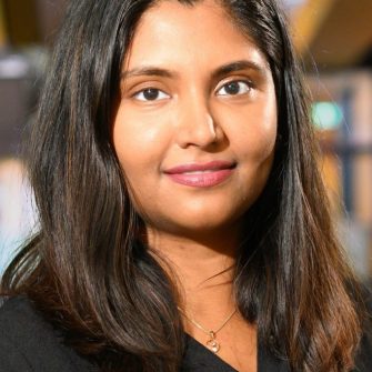 A headshot of a student looking at the camera and smiling.