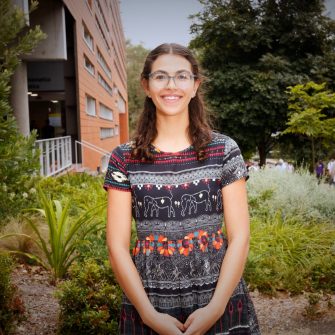 A headshot of a student looking at the camera and smiling.