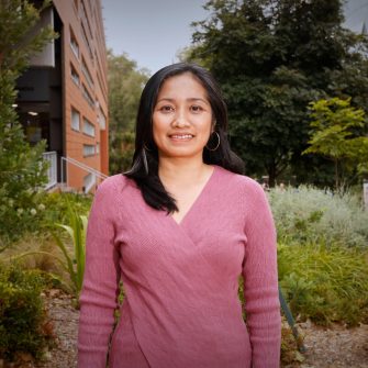 A headshot of a student looking at the camera and smiling.