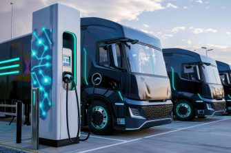 modern electric truck charging at a gas station