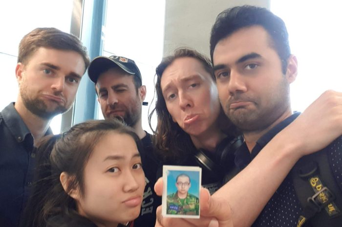 A bunch of cool kids mimicking Johnson's military poker face