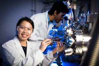 Scientists calibrating science machines