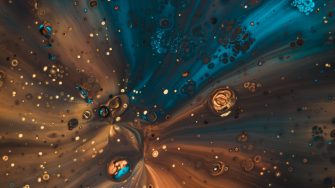 Acrylic paint poured through a funnel