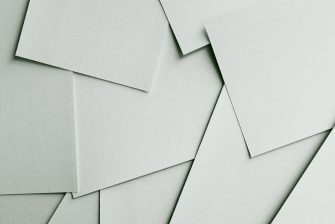 Scattered sheets of white paper