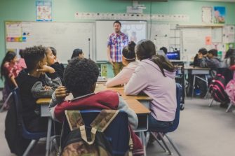 students in classroom with teacher
