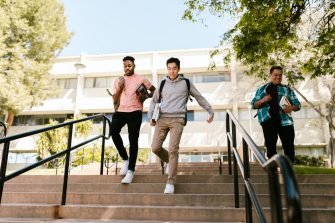 Students running down stairs