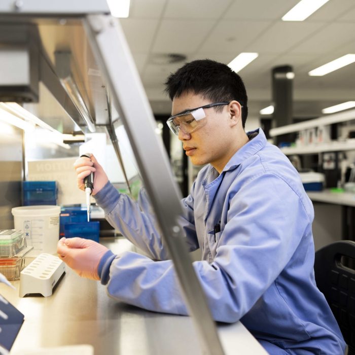 Pipetting in fume hood