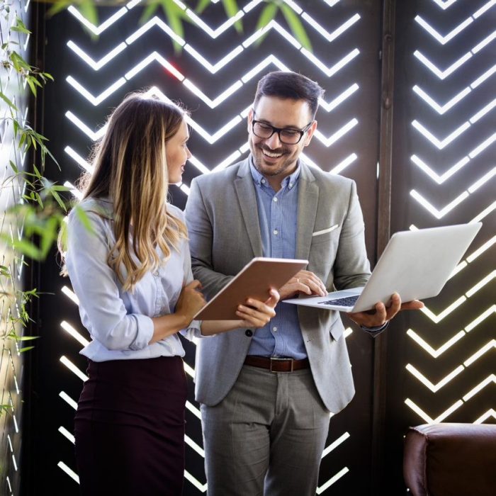 Two business colleagues at meeting in modern office interior