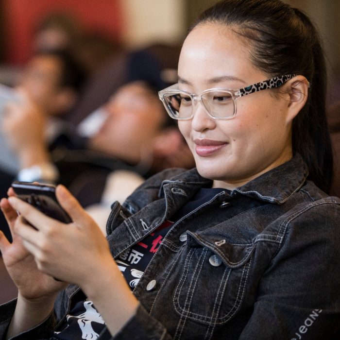 Female student looking at mobile phone