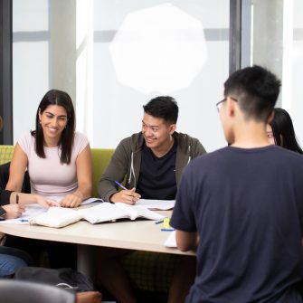 A group of people meeting in a corporate environment. 