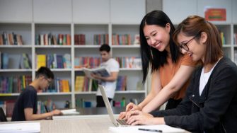 Students studying with books and laptops in the Library Support Unit (LSU)