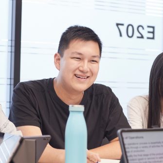 Students sitting at desk in classroom