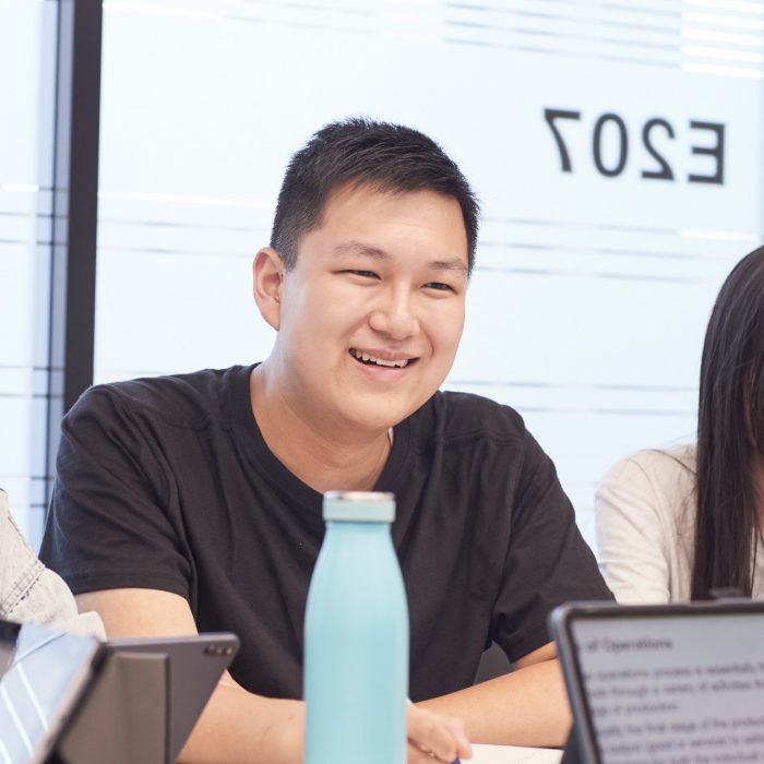 Students sitting at desk in classroom