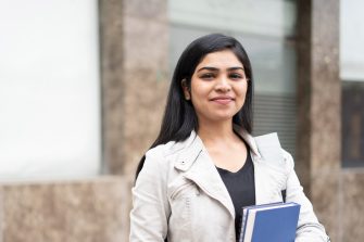 Studious student holding books